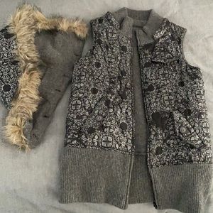 Reversible vest with detachable hood
